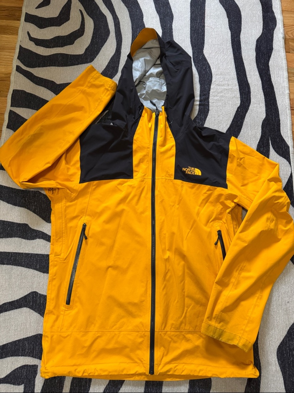 The North Face Yellow and Black Hooded Rainshell Jacket